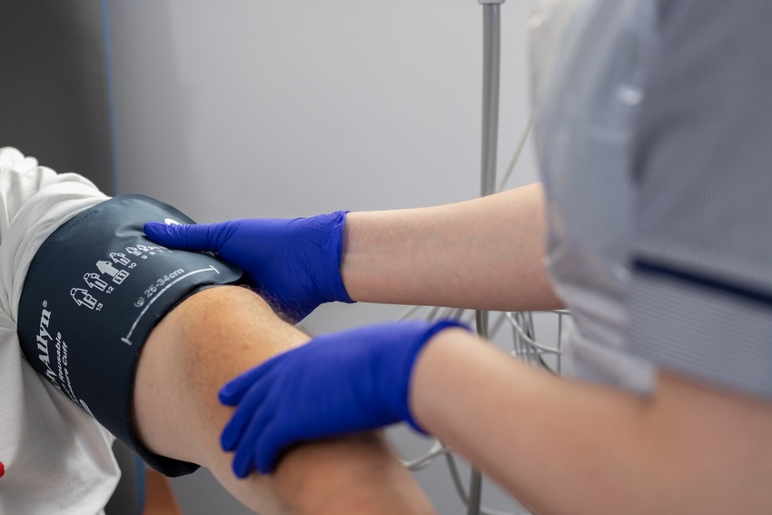 A nurse taking a patient's blood pressure