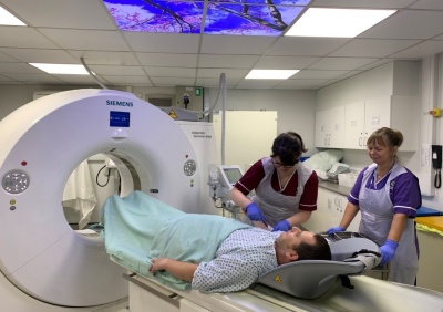 CT scanner couch staff and patient.jpg