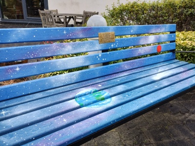 Another of the memorial benches at CCC-Aintree - this one is blue and purple and has a cosmic space theme